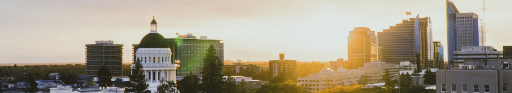 A landscape photo of a city during sunset